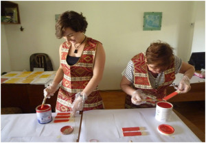 AWHHE expert and volunteer preparing samples of the purchased paints for analysis by IPEN